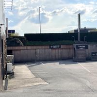 Picture of the kinda hidden driveway to the shop. The shop is in the back of the Cook-Art building and not instantly obvious to reach.   at Le Bon Wagon in Eupen