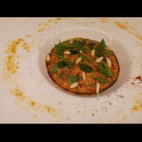 Crema di pappa al pomodoro con sopra basilico menta pinoli origano fresco at Marco Vitale Chef in Florence