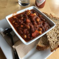 Cup of Vegan Black Bean Chili. Goes great with the Vegan Street Tacos. Beware - the 2 sides offered with the chili are NOT vegan (ciabatta bread & crackers) so I requested wheat bread which they said was vegan. at Peoples Organic in Eden Prairie