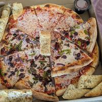 A cheese, a veggie, and cheese sticks. Way too good to take a pic while fresh, this is the next day leftovers. lol at Pizzoco in Winchester