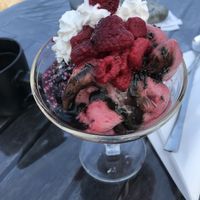 ”Blåkulla”. Raspberry sorbet, liquorice Ice cream, black liquorice sauce, sprinkles as vegan whipped cream. at Källa Glassgård in Lottorp