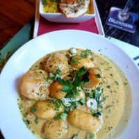 Curry dish with potatoes,chickpeas and rice and naan bread at Delaney's in Bruges