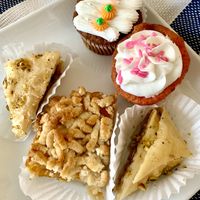 Carrot cake & strawberry cupcakes, Orange cobbler, pistachio baklava, walnut baklava (insert happy dance here 😋)  at Nabati Vegan Mediterranean in Oklahoma City