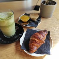 croissant with matcha latte at RoseHip Bistro - Pylimo in Vilnius