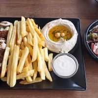 Falafel plate with fries, houmous, sesam sauce, salad, and bread at Lebanese Corner in Lisbon