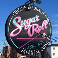 Their logo on a panel outside the restaurant. at Sugar Roll Japanese Cuisine in Dieppe