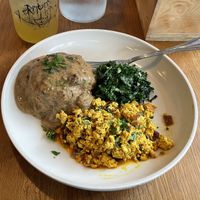 Tofu scramble, flakey biscuit with gravy and steamed garlic kale!   at Fermenter in Portland