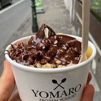 Small froyo with granola, strawberries, pineapple and dark chocolate sauce   at YOMARO - Oberkassel in Dusseldorf