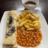 Sausage roll with chips, beans and gravy, 230,000 VND  at Filthy Vegan in Ho Chi Minh City