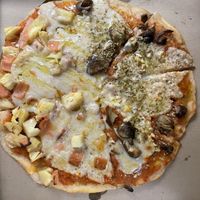 Half half Hawaiian and mushroom and garlic pizza  at Filthy Vegan in Ho Chi Minh City