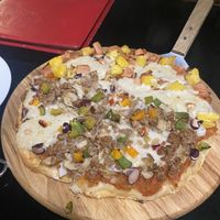 Pizza half Mexican half Hawaiian   at Filthy Vegan in Ho Chi Minh City