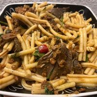 Bolognese with basil and shredded parm, mushrooms (PLATED) at VEGA - Alamo in Madrid