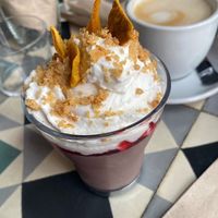 Pannacotta and oat milk decaf coffeee  at VEGA - Alamo in Madrid