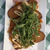 Seitan Beef Carpaccio on smashed sweet potatoes   at VEGA - Alamo in Madrid