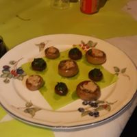 Mushrooms filled with garlic and parsley butter at Gewoon.Anders in Ghent