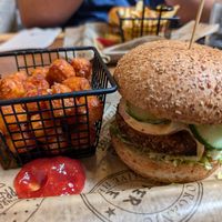 Village veggie burger with slippery puffball toppings, side of sweet potato tots at Burger Village in San Luis Obispo