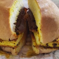 Bacon, egg and cheese with hot sauce at How Delish HD in West Orange