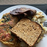 Chicklette (chickpea omelette), home fries, toast, and bacon at How Delish HD in West Orange