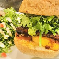 Marinated Tempeh Burger w/ creamy kale salad  at SunCafe in Studio City