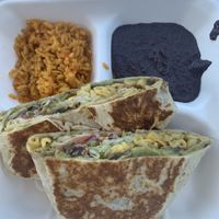 Vegan Crunchwrap with side of rice and beans. Subbed meat for guac.   at Nuno's Tacos & Vegmex Grill in Dallas