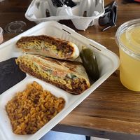 Nuno’s Crunchwrap w/ side of black beans and rice.   at Nuno's Tacos & Vegmex Grill in Dallas