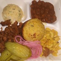 BBQ plate with mac n cheese, baked beans, potato saladn cornbread. This was just okay, and it is offered seasonally. at Nuno's Tacos & Vegmex Grill in Dallas