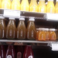 Orange juice, orange mango juice, a green juice, cayenne shot, ginger shot and lemonades. at CLT - Pret A Manger - CC in Charlotte