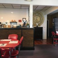 Kitchen is behind and there are lots more tables  at Wish Thai Kitchen in Watertown