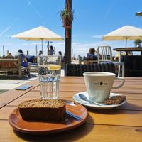 Banana bread & cappuccino w/ oatmilk at Beachclub Copacabana in The Hague