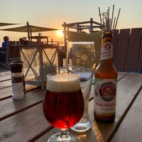 Beer and sunrise  at Beachclub Copacabana in The Hague