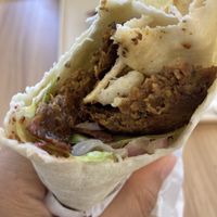 Half eaten gyro wrap (of course forgot to take the picture before attacking it 😂)  at Happy Vegans in Clifton