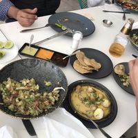 Ceviche, potatoes with cheese (Raclette), different spicy sauces at Vegan Inc in Puebla