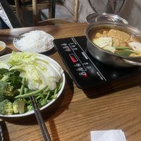 The hotpot ingredients and the soup (tomato)  at Ngon Vegan Restaurant in Tam Coc
