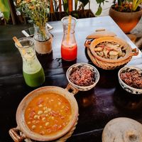 Coconut curry chickpeas and tofu with mushrooms. Green juice and pineapple juice at Ngon Vegan Restaurant in Tam Coc