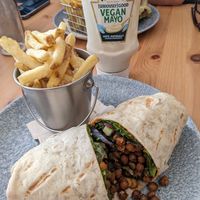 Spanish harissa chickpea wrap and skin on fries at Farmhouse Kitchen in Kendal