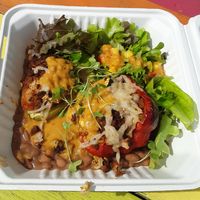 Pimiento Relleno: bell pepper stuffed w/ calabaza, brown rice, cauliflower "chorizo carnitas" tofu & seitan, ranchero sauce, & vegan Pepper Jack, w/ charro beans & fresh greens at Pepe's Bistro in Lincoln
