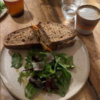 Kimchi tofu roasted sandwich and oat flat white   at The Hairy Barista in Totnes