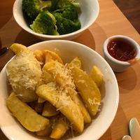 A side of steamed broccoli and some chips with shredded parmesan. Vegan, of course! at Luna's Vegan Corner in Cardiff