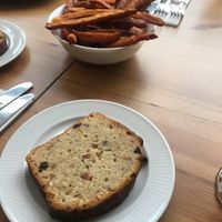 Cake of the day and sweet potato fries.   at Luna's Vegan Corner in Cardiff