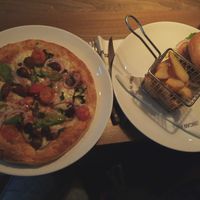 Vegan pizza and burger with fries at Peppes Pizza in Bergen