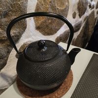 Complimentary pot of tea. And a lovely stone wall. at Gosto Superior in Braga