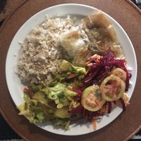 Seitan cake with brown rice and veggies on the side. at Gosto Superior in Braga