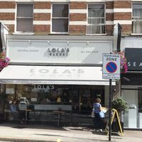 front of bakery  at Lola's Bakery in North West London