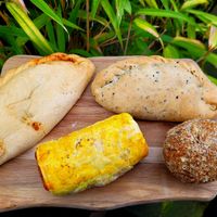 Spiced Veg Pasty, Vegan Bean Roll, Vegan Curry Oggie, and Vegan Scotch Egg. at Llangollen Oggie Shop & Fine Foods in Llangollen