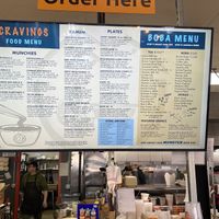 Menu above the cashier. Cannot read from afar.  at Cravings Deli in Portage
