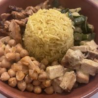 Bowl di riso basmati allo zafferano con “Pollo”, tofu, zucchine e ceci  at Circolo Arci Impatto Zero in Pavia