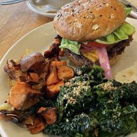 Yummy double vegan cheeseburger (house made patty), kale salad, and sweet potato hash 💚  at True Food Kitchen in Phoenix