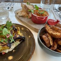 Cauliflower steak, tagine and potato wedges. Be sure to ask for the vegan mayo for the potato’s    at Hotel Casa in Amsterdam