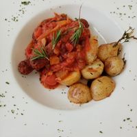 Vegan sausages with tasty bean cassoulet and herb potatoes at The White Lion Inn in Pulborough