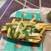 Loaded fries with “cheese"  at Vedang - green burger | Alexa in Berlin